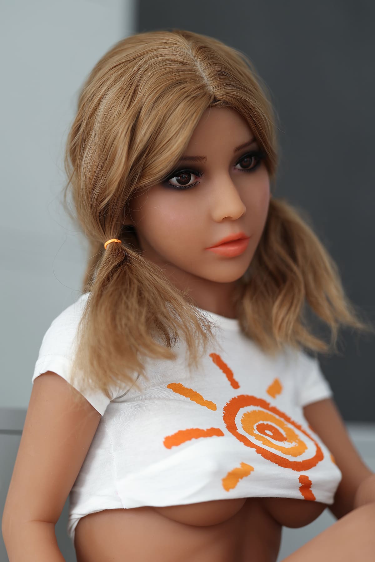Blonde pigtails tanned young sex doll