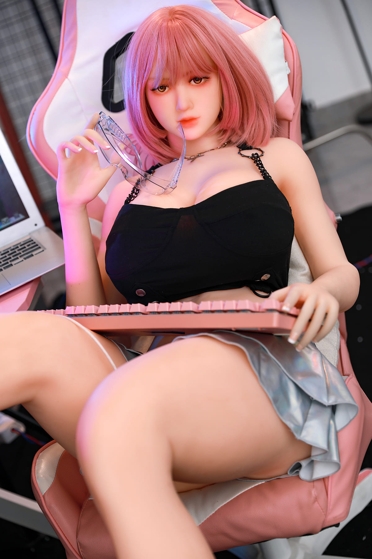 Busty female sex doll in a short skirt