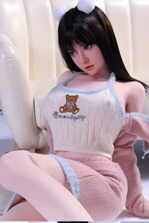 Cute Asian sex doll in a sweater