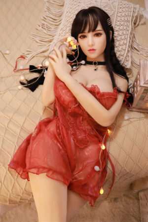 Brown eyed Asian sex doll in red dress