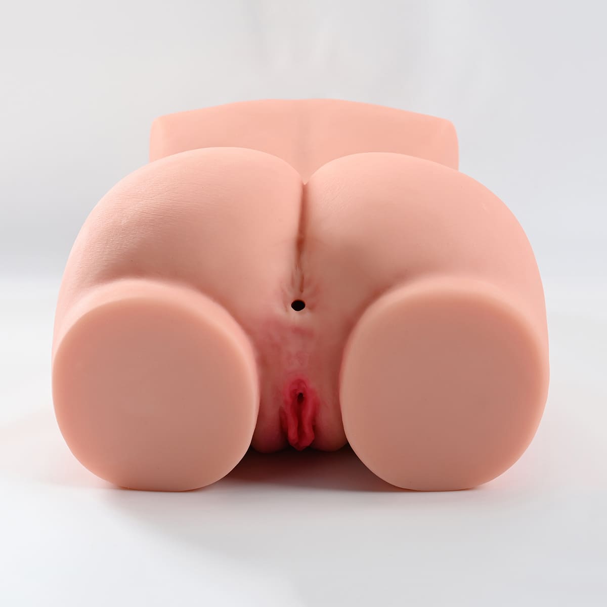 Pink pussy and anal of fair skin sex doll torso