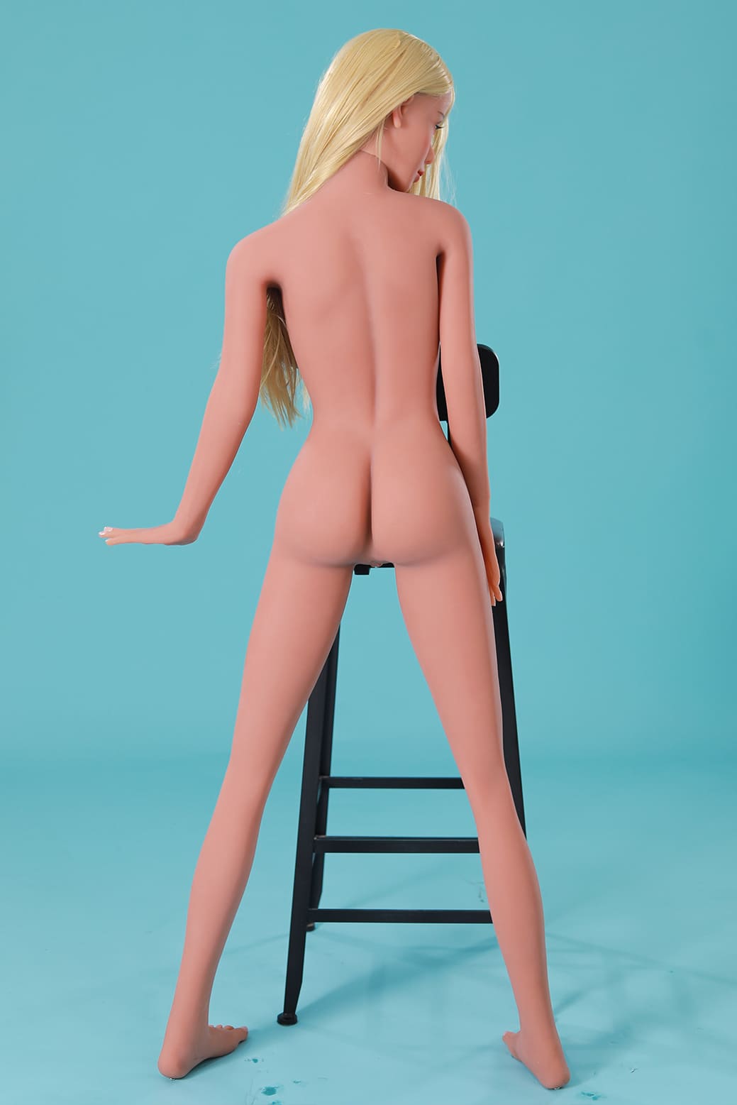 light tanned blonde female love doll backside